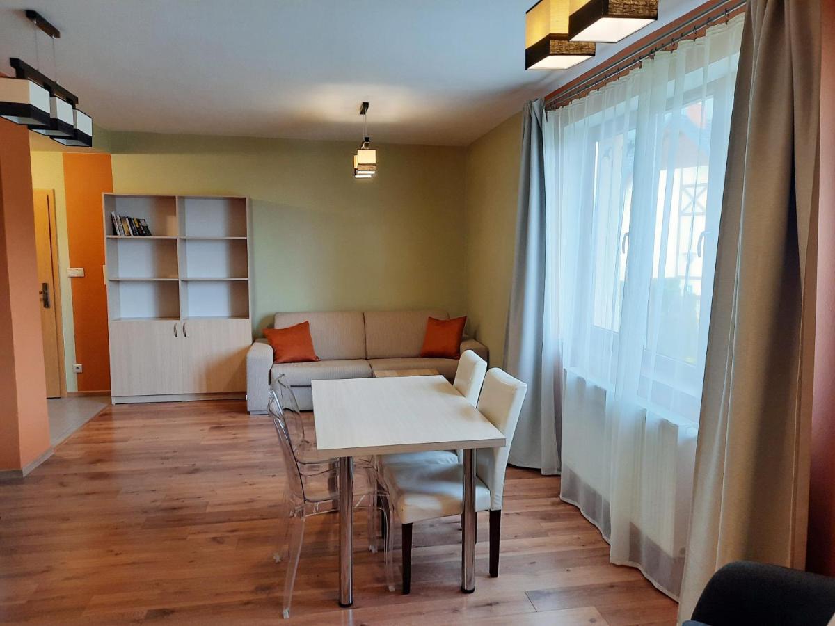 Bright living room with sofa and dining area in Apartments Piknik, Stará Lesná